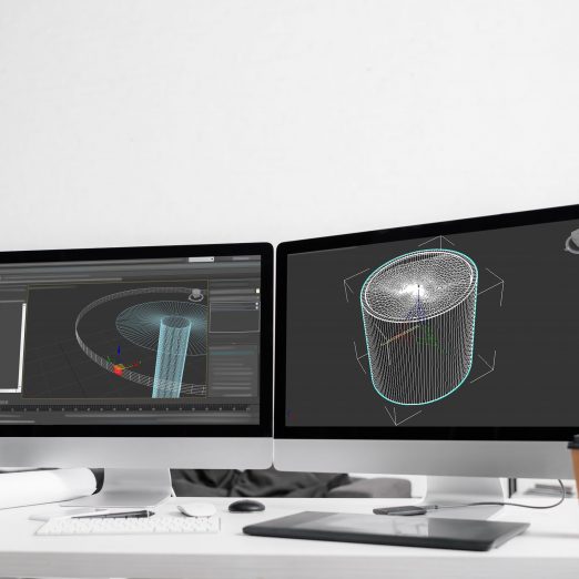 3d project of computer monitors, graphics tablet with coffee to go and vr headset on table in office