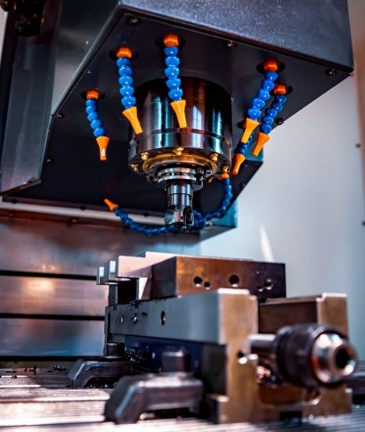 Metalworking CNC milling machine. Cutting metal modern processing technology. Small depth of field. Warning - authentic shooting in challenging conditions. A little bit grain and maybe blurred.
